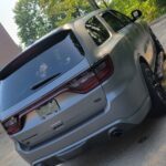 Silver SUV parked in a sunny lot.