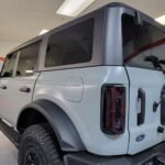 SUV in a well-lit garage interior.